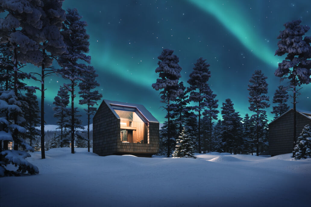 Sky Villa Antti exterior in a snowy winter night landscape at Arcora