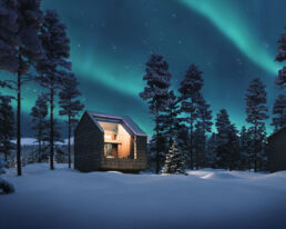 Sky Villa Antti exterior in a snowy winter night landscape at Arcora